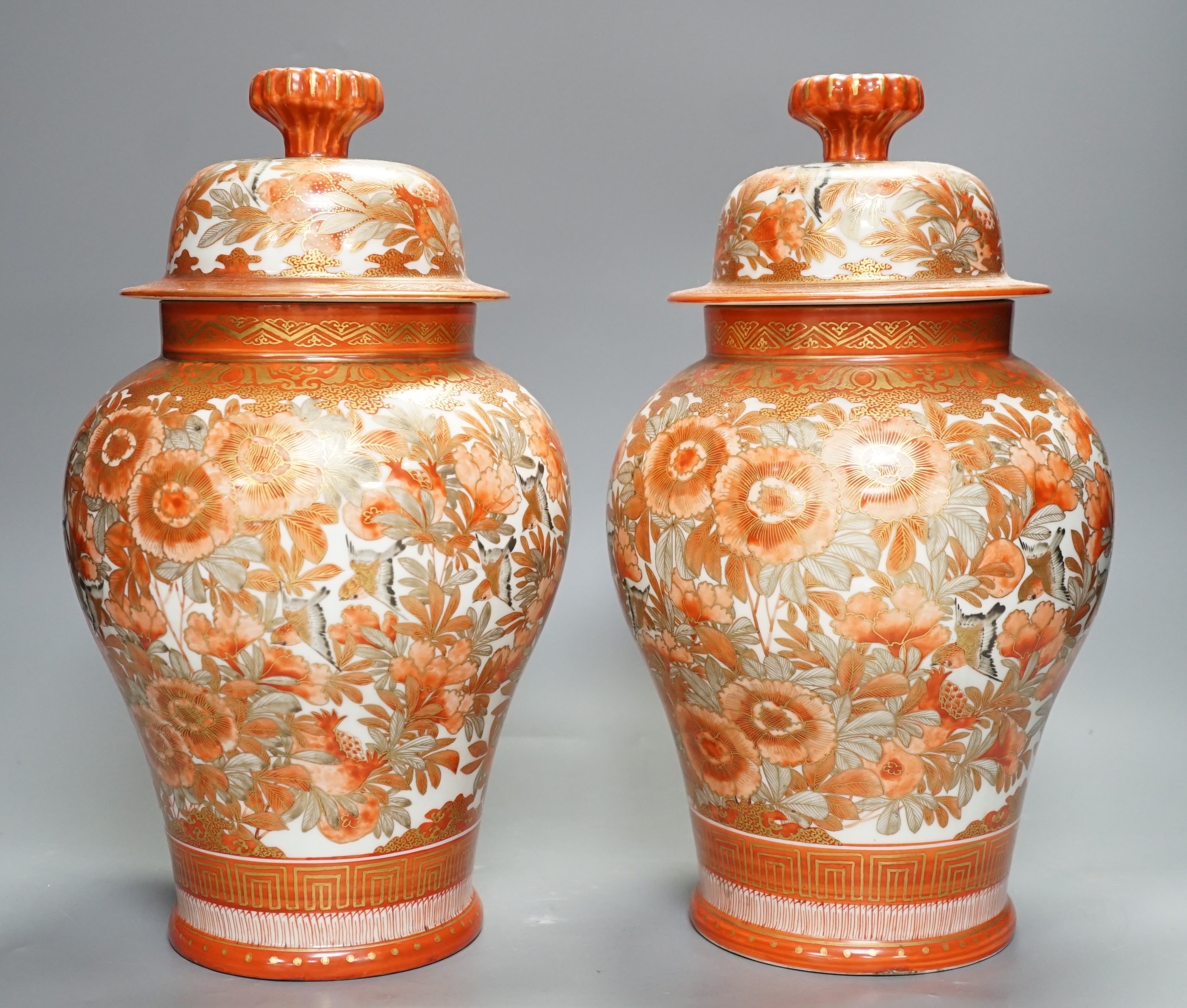 A pair of 19th century Kutani lidded ovoid shaped vases. 33cm high